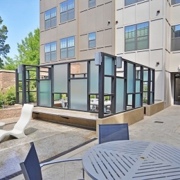 a courtyard with tables and chairs