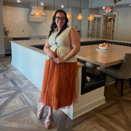 a woman standing in a kitchen