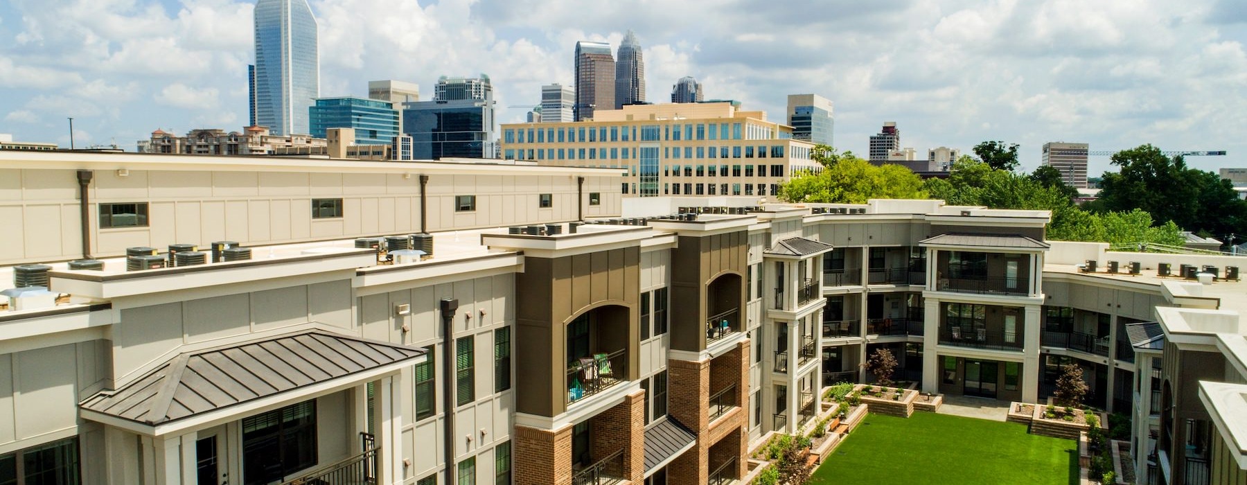 a building with a green lawn